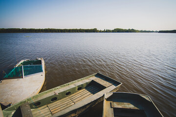 Old wooden boat in the lake. Romantic boat rides on the lake.