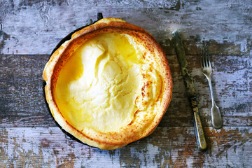 Dutch baby pancake in a pan. Fresh homemade Dutch baby cake.
