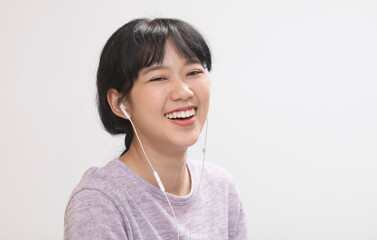 Young asian girl listening music