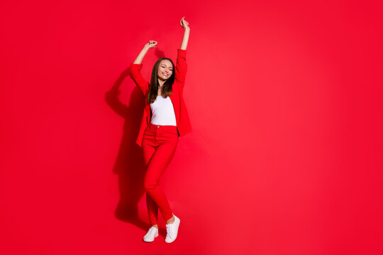 Full Body Photo Of Attractive Funny Business Lady Success Worker Having Fun Corporate Party Colleagues Event Meeting Wear Blazer Suit Pants Shoes Isolated Red Color Background