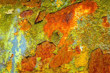 A rusty piece of iron with scaling paint