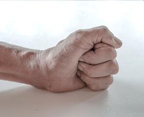 The old man's hand clasping on the white background