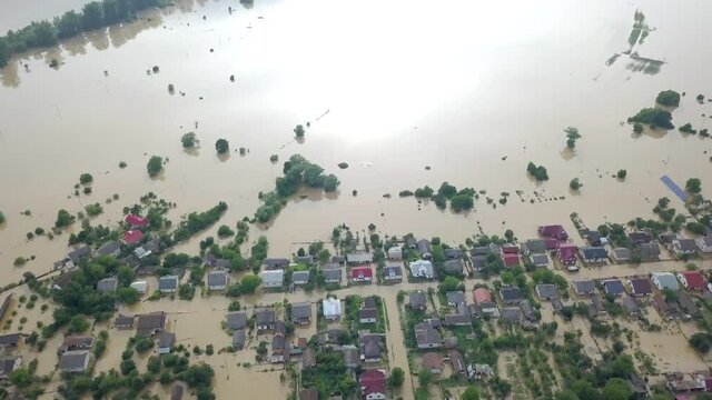 Flooded neighborhood street. Major flooding leaves city, underwater, entire community. Homes, houses overflowing water, insurance needed. Rescue teams helping people Ivano-frankivsk Galych, Ukraine