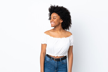 Young African American woman isolated on white background looking side