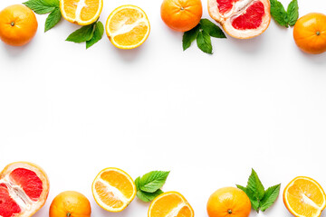 Frame sliced citrus mix white background top view