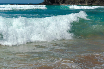 beautiful view of the beach coast of the Atlantic ocean in Portugal. Tourism and recreation. Waves break on the shore, banner.