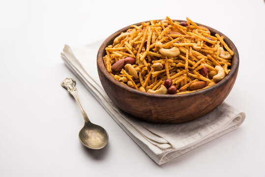 Aloo Chivda or Potato Chiwda also known as Falahari Namkeen for Vrat.&nbsp; Traditional Fasting snack recipe from India, garnished with Cashew Nuts and Almonds