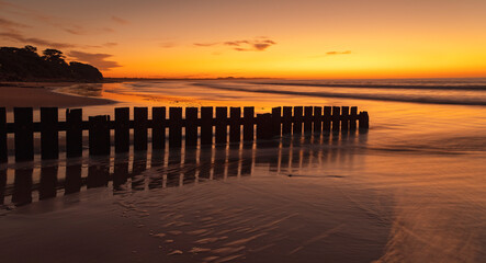Sunrise on Torquay beach, Surf Coast, Victoria, Australia featuring the wooden groyne