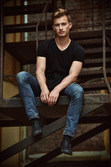 Fototapeta premium attractive guy on stairs