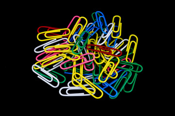 Pile of Coloured Paper Clips on a Black Background