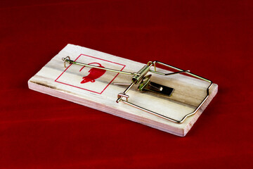 Wooden Mouse Trap on a Red Background
