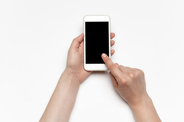 Close up of human hands using smartphone isolated on white background. Top view. Copyspace, blank screen. Surfing, online shopping, scrolling, betting, working. Education and business concept.