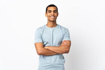 African American man over isolated white background keeping the arms crossed in frontal position