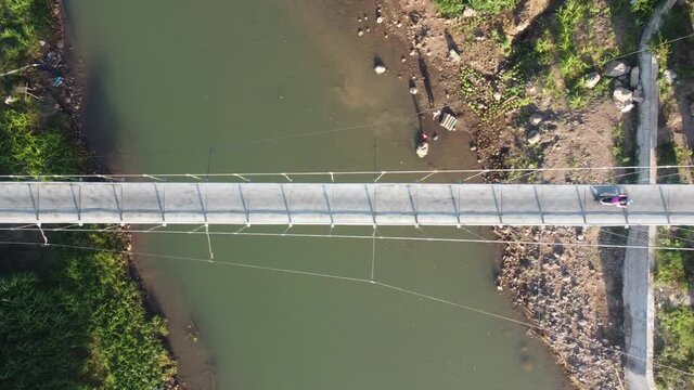 aerial view of the Pengkol suspension bridge in Imogiri Bantul, the bridge across the Oyo river