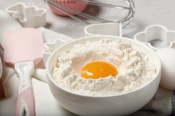 Baking utensils and ingredients. Rolling pin, cookie mold on a gray background. Easter concept.