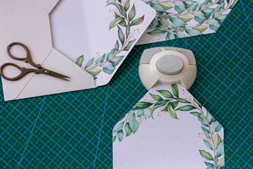 creating an envelope for a wedding invitation with sprigs of eucalyptus