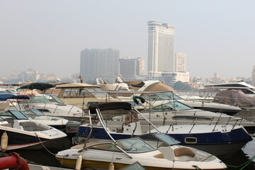 Fototapeta premium Luxury motorboats and yachts at the dock. Coast, Luxury motorboats and yachts at the dock. Marina Cairo Egypt