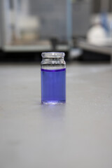 Purple chemical solutions in a science laboratory. Analytical chemistry