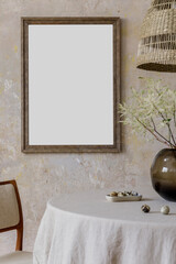 Stylish and elegant dining room interior with diner table, design chairs, rattan pendant lamps,...