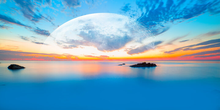 Long exposure of sunset at Alanya Beach, Alanya, Antalya - Long exposure image of Dramatic sky and seascape with rock and full moon " Elements of this image furnished by NASA"