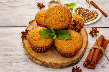 Obraz na płótnie Canvas Homemade cupcakes with cinnamon, star anise and fresh mint. Autumn good mood, warm weather