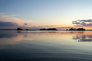 Magical fairytale sunset in the evening on the lake