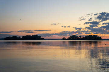 Naklejka premium Magical fairytale sunset in the evening on the lake