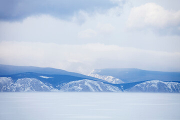 Winter landscape. Baikal lake. Snowy mountains