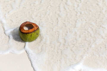 Fresh cut coconut on the beach, Saracen bay beach, Koh Rong Samloem island, Sihanoukville, Cambodia.