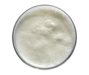 Boiled milk in a glass cup on a white background. Isolated