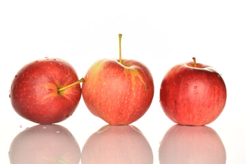 Red ripe apples, close-up, on a white background.