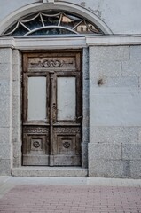 old wooden door in stone wall