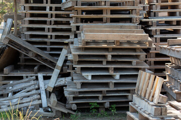 many old pallets are in a heap