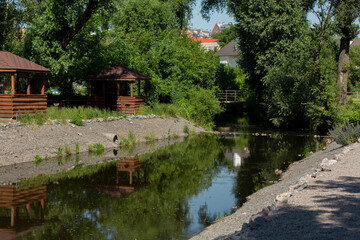 Fototapeta premium decorative river in the city with wooden houses