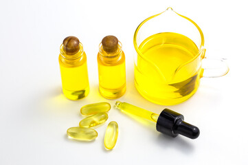 Hemp oil in a glass jar isolated on a white background, Pure cold pressed oils concept, CBD hemp...