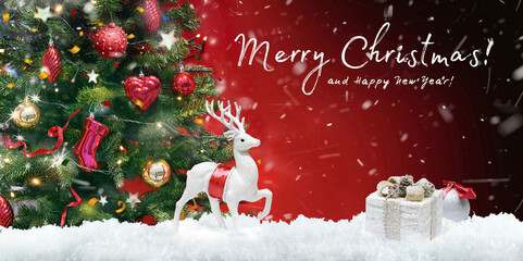 Fototapeta na wymiar Beautiful green decorated Christmas tree and white Christmas deer with gifts on evening dark red background with flying snow fluffs and inscription Merry Christmas. Bright colorful artistic image.