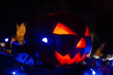 Glowing pumpkin in the dark close-up. concept of the Halloween, background.