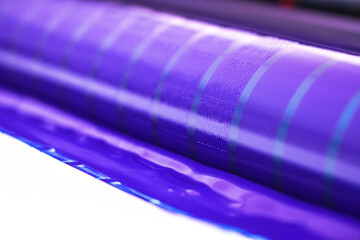 Traditional offset press. Printing in ink with CMYK, cyan, magenta, yellow and black. Graphic arts,...