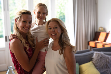 Caucasian woman with her daughter and mother at home