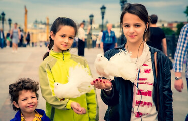 Moscow, Russia. June 30, 2015: white pedigree pigeons sitting on the hands of children walking around Moscow
