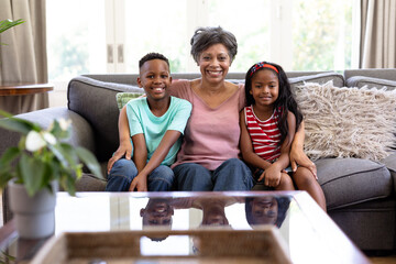 Senior mixed race woman and her grandson at home