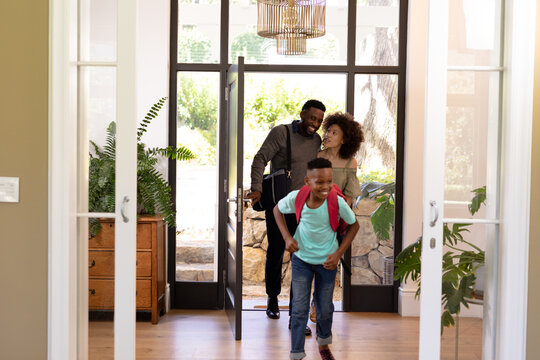 Mixed race family returning home - Powered by Adobe