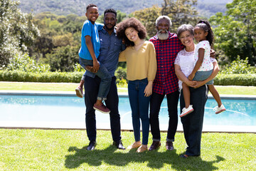 Multi-generation mixed race family enjoying their time at a garden