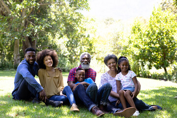 Multi-generation mixed race family enjoying their time at a garden