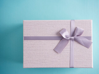 Gifts box on light blue background.