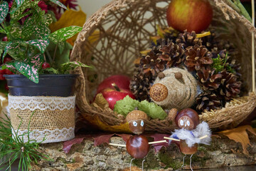 autumn composition of a hedgehog from cones, autumn composition, children's art forest animals