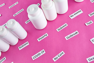 White plastic bottles with pills and coronavirus, pandemic headline clipping words on pink background.