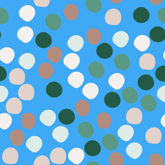 Random colored polka dots seamless pattern. Circle shapes wallpaper on blue background.