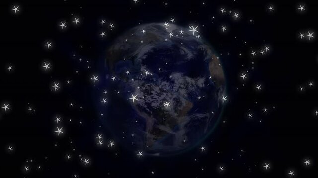 Digitally generated video of glowing stars and spinning globe against black background