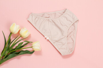 Beautiful women's cotton panties on a pink background.